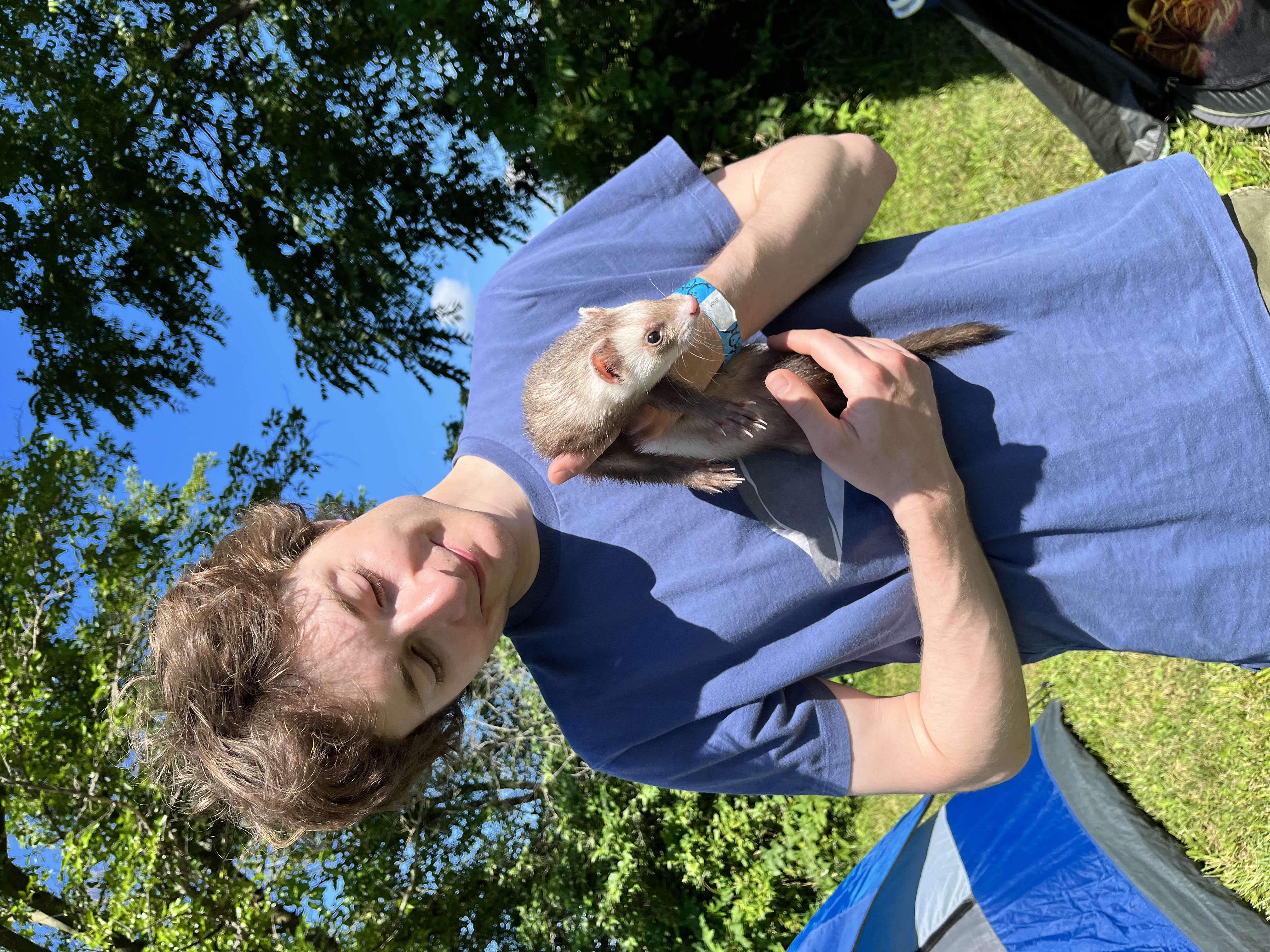 Me holding my friend's pet ferret.