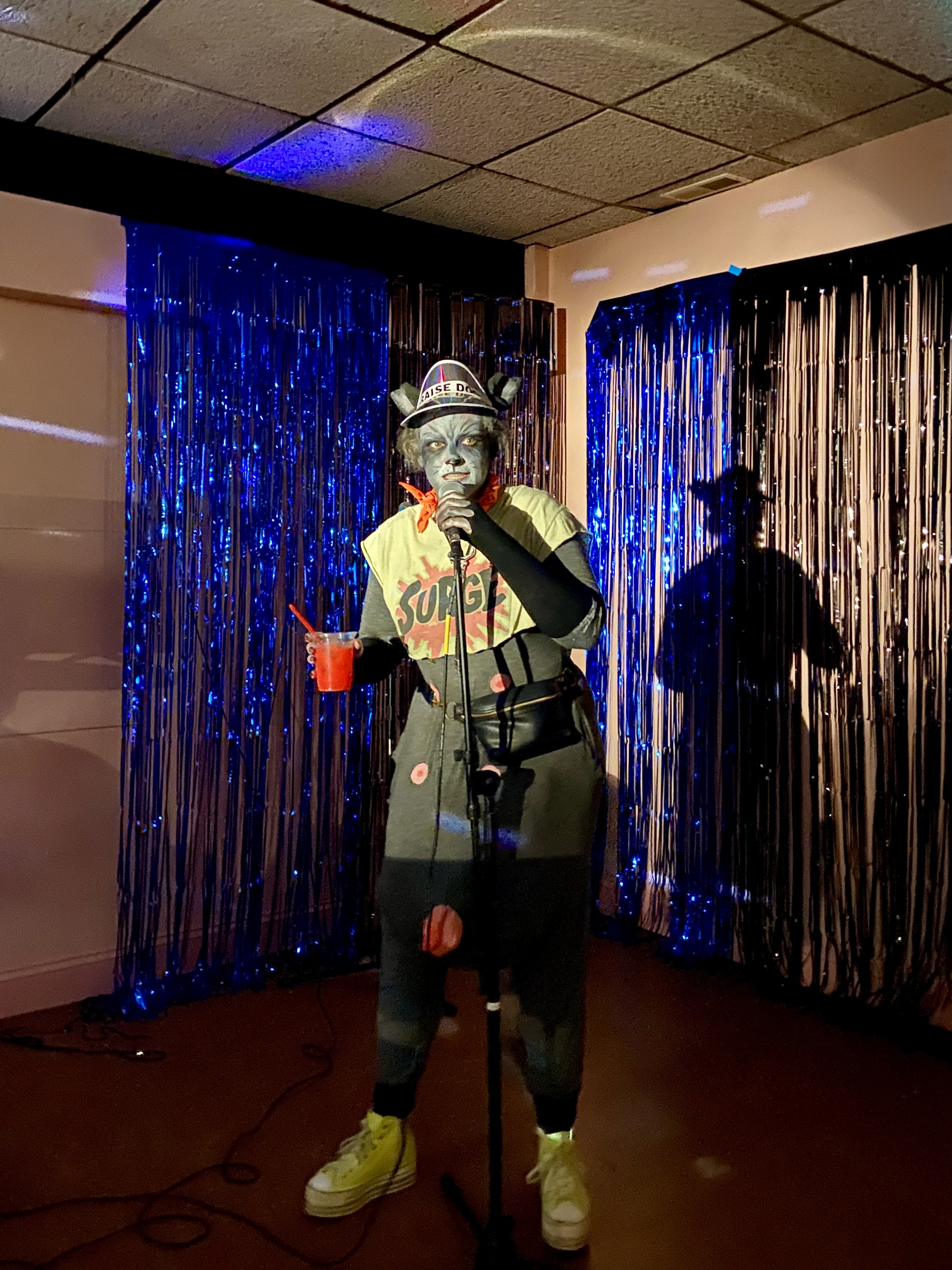 Randy the Raccoon (Mary Williamson) performing at Color Club Cosmic Country Karaoke.